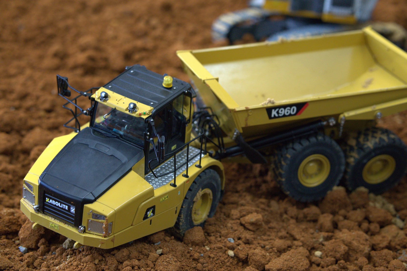 RC excavator and dump truck session photo from the Melbourne indoor arena